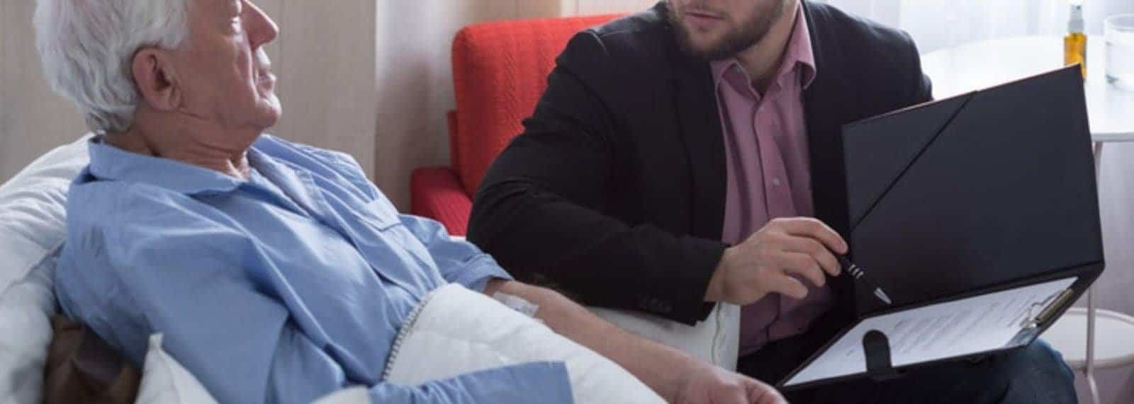 a man in a suit and a woman in a hospital bed